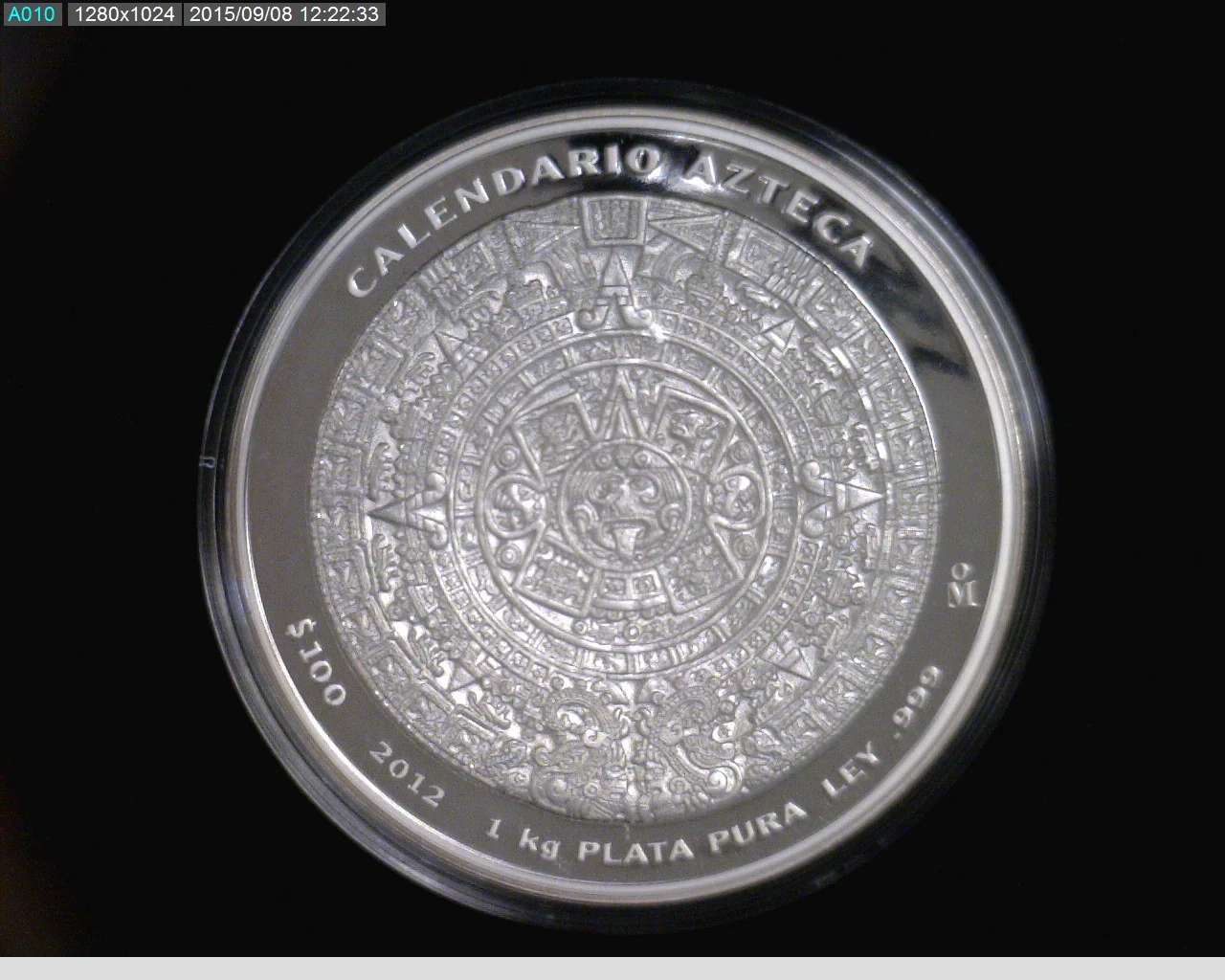 100 Pesos 1 Kilogramo, Calendario Azteca, Mate-brillo 2012 · Reverso