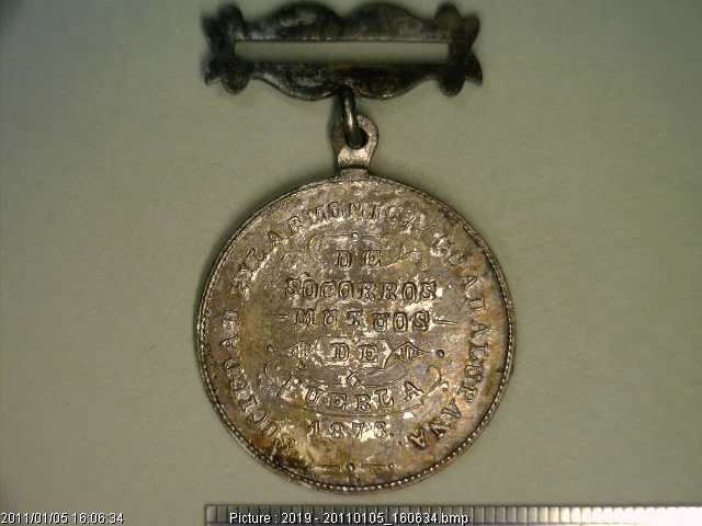 Medalla Puebla. Sociedad Filarmónica Guadalupana de Socorros Mu (1876) (anverso)