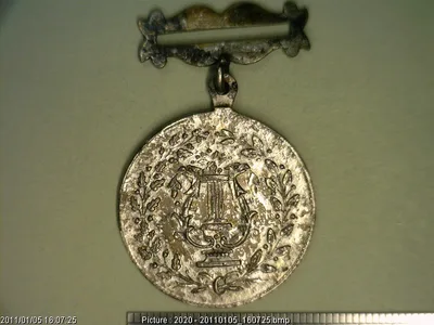 Medalla Puebla. Sociedad Filarmónica Guadalupana de Socorros Mu (1876)